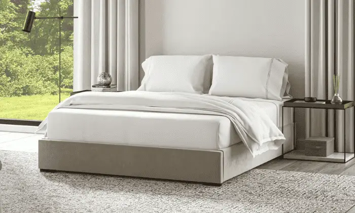 A platform bed in a typical bedroom in the cozy, modern look